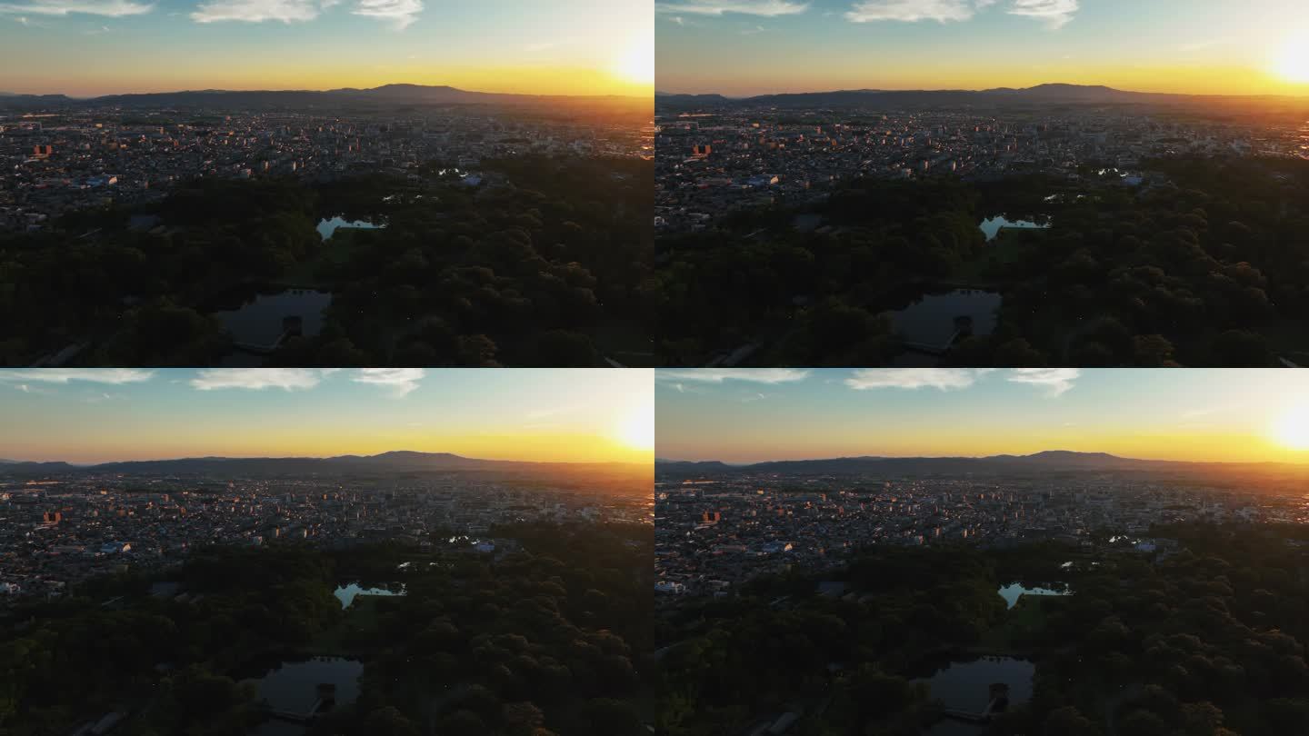 在奈良公园上空飞行，五彩缤纷的日落在日本-鸟瞰图