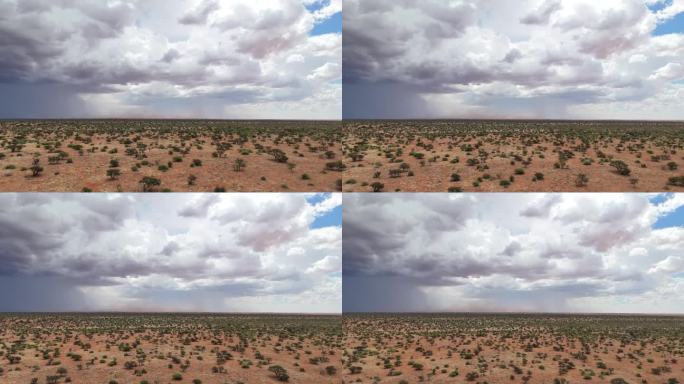 南部喀拉哈里沙漠的航拍画面，远处乌云密布。