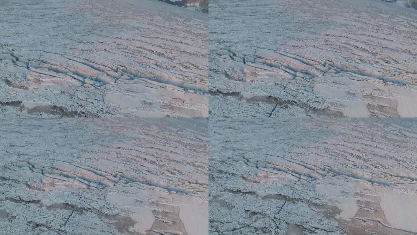 从鸟瞰的角度看，冰川展开了它迷宫般的裂缝和山脊，被无人机向上移动的画面放大了。