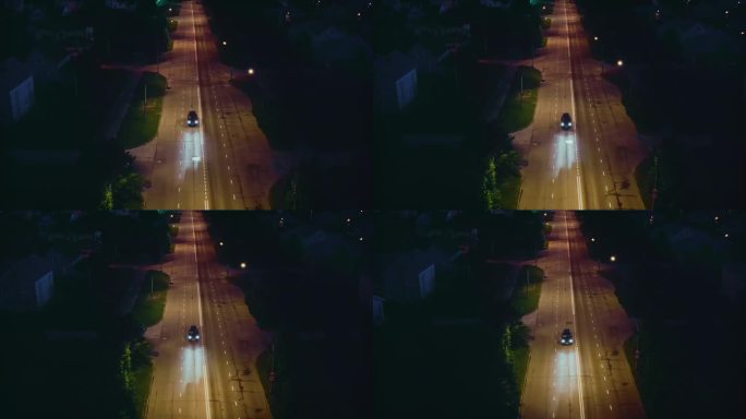 夏天，郊区的夜晚，汽车驶过城市街道上的减速带。无人驾驶飞机。