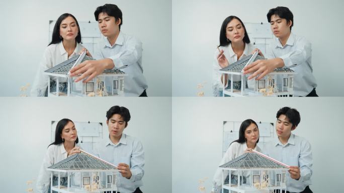 合作专业建筑师团队专注于测量房屋模型。完美无暇的