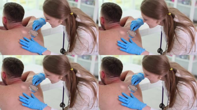 肿瘤学家用放大镜检查成人皮肤上的肿瘤