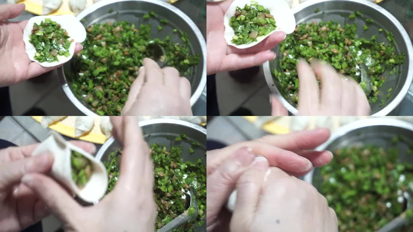 中国除夕夜妈妈的手在包饺子传统美食文化