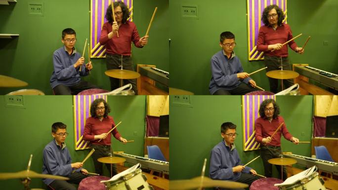 中年男子在录音棚教他的学生男孩架子鼓
