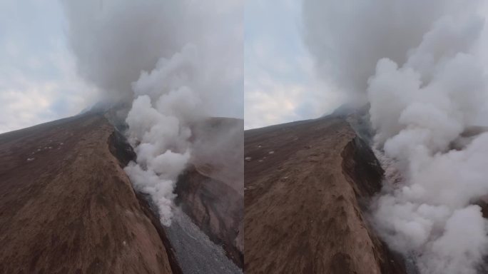垂直视频。火山活跃喷发，峰顶热熔岩烟流，灾情极端