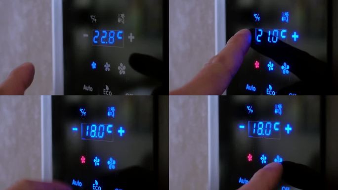 视频4 k。曼斯用手指在房间墙壁上的电子面板上设定空调的温度。现代室内气候控制系统