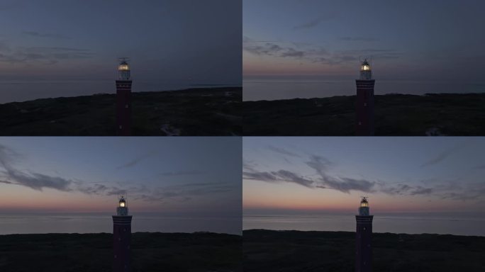 日落时，灯光亮起的韦斯特伍德灯塔的轨道拍摄，航拍