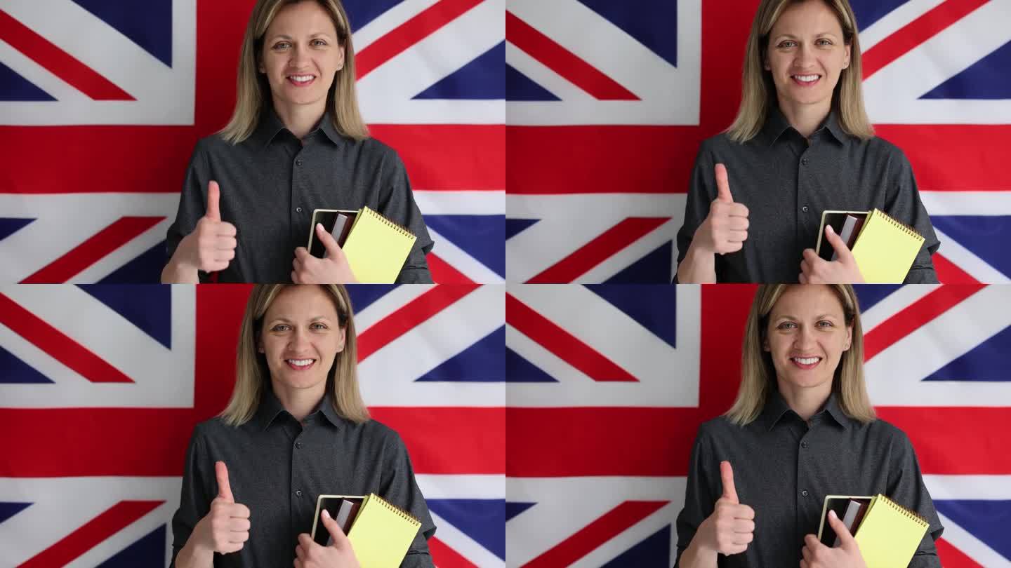 一名女子拿着英语课本，竖起大拇指，背景是英国国旗4k慢动作电影