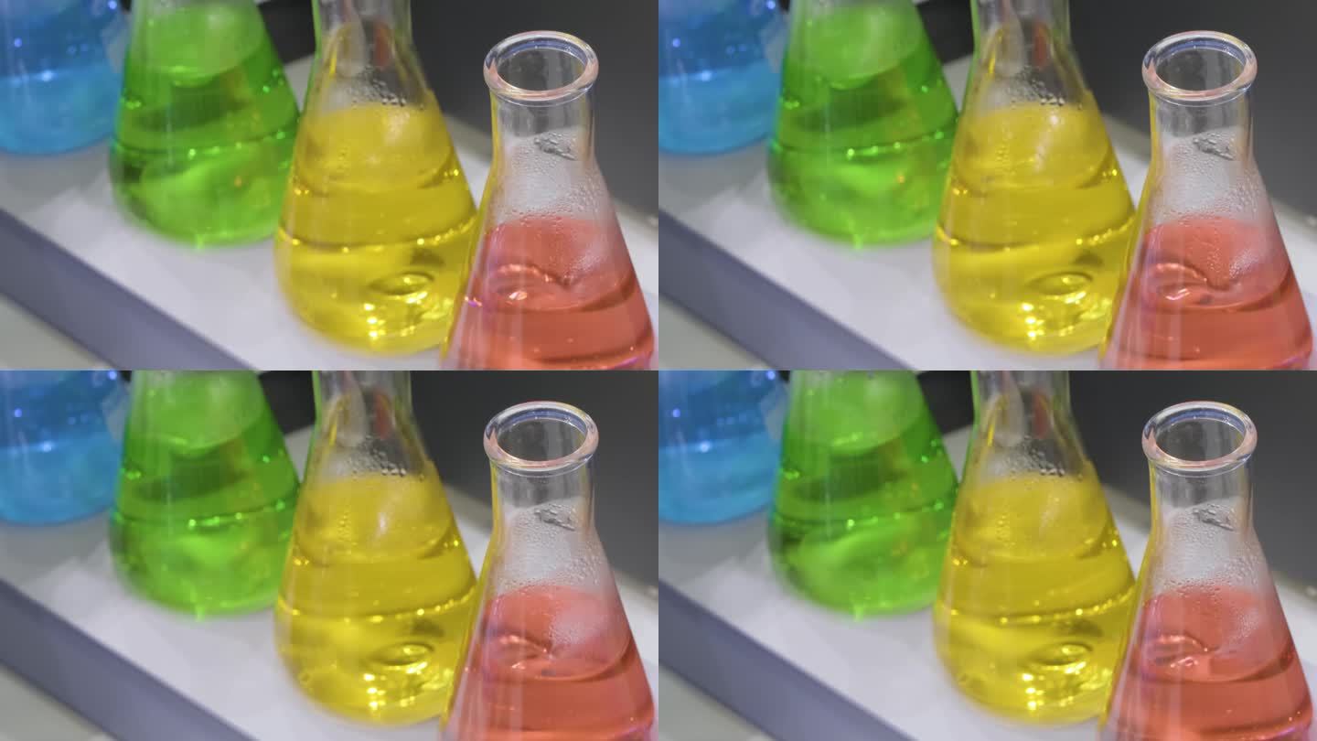 科学实验用玻璃烧杯中的液体混合。关闭了。分析实验室。混合溶液。实验室搅拌机。