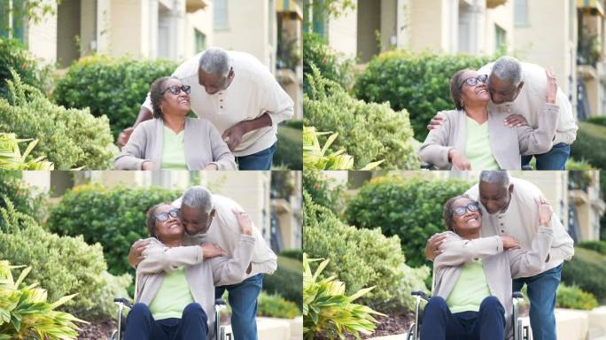 老年非裔美国夫妇拥抱，轮椅上的女人