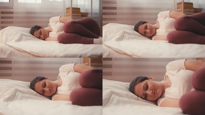 在床上经历痛经的女性，面临子宫内膜异位症的挑战