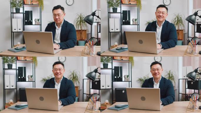 幸福微笑的亚洲中国商人的肖像在家庭办公室看向别处，转过头对着镜头