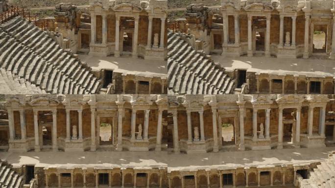 古代圆形剧场与罗马柱和石像，全景。