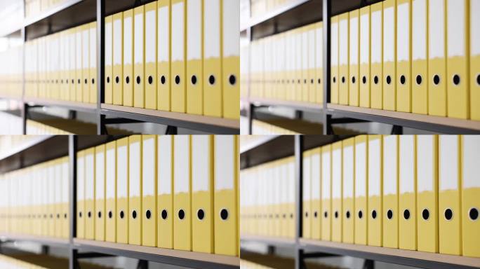 书架上有许多黄色的文件夹，近距离4k电影慢动作