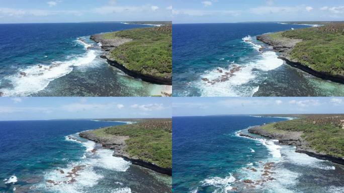 鸟瞰图南太平洋海浪在波利尼西亚的汤加海岸破碎。风景和珊瑚礁