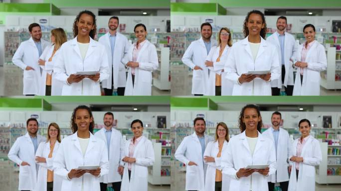 一位快乐的黑人药剂师带着一群员工在药店工作，微笑着看着镜头