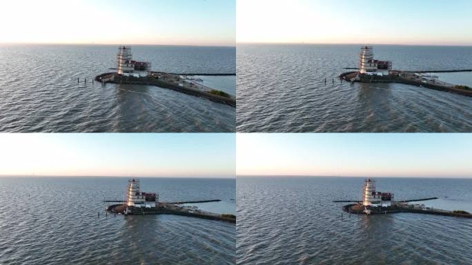 鸟瞰日出时荷兰马尔肯岛的帕德·范·马尔肯传统历史纪念碑灯塔。欧洲的一个小渔村。