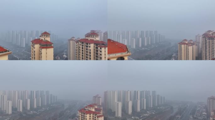 航拍冬天大雾襄阳东津城市高楼房建筑风光