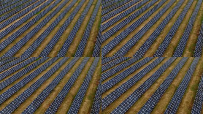 鸟瞰图的太阳能电池板与对角线运动，因为它接近。可再生能源。绿色能源。对环境的友好态度。世界环境规划署
