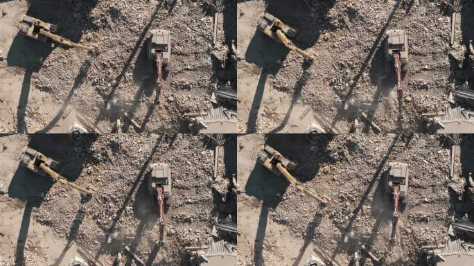 拆除建筑物。挖掘机在拆迁现场清理垃圾。无人机拍摄的被毁建筑，俯视图
