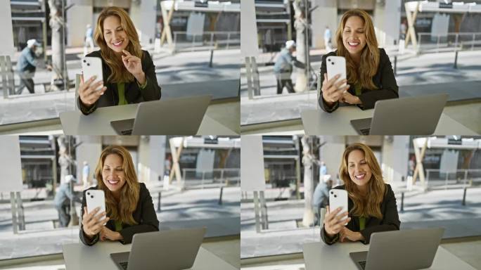 微笑的西班牙女性在现代办公室室内使用智能手机，展示科技，专业和生活方式的元素。