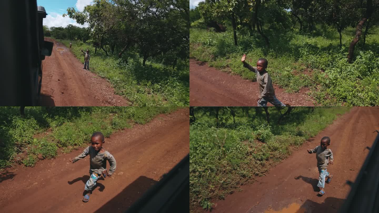 卡车在土路上，活泼的孩子们奔跑，在非洲村庄里挥手