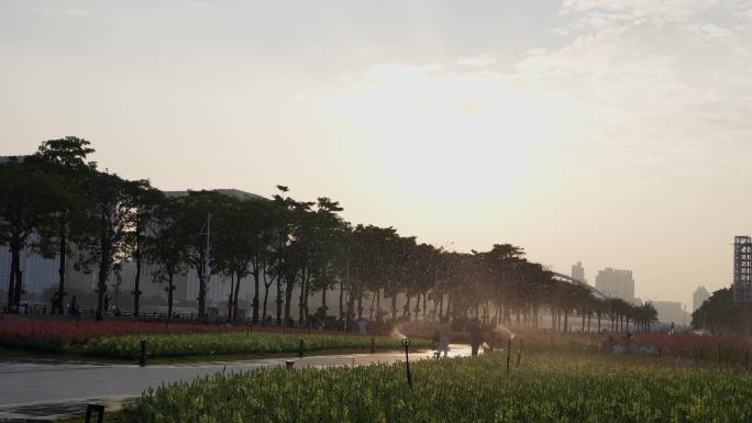 4K实拍广州珠江新城海心沙日落与洒水浇花