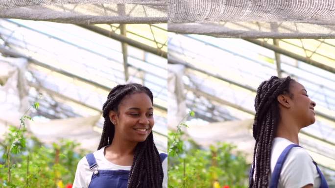 黑人女苗圃工作人员非常高兴，在花丛中跳舞