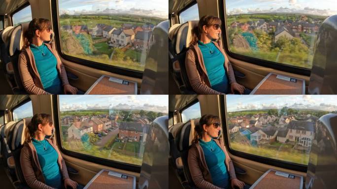 开朗的女士在阳光明媚的日子坐火车旅行时欣赏美丽的乡村