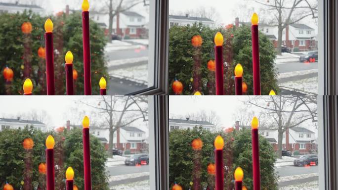 圣诞节窗台上的红色烛光。向上倾斜，慢动作。