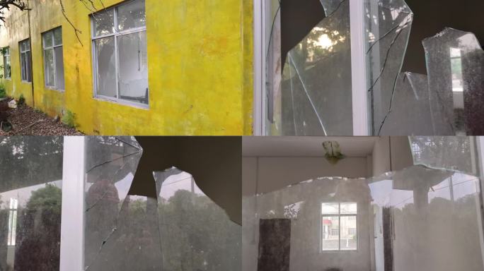 休置的房子窗户破烂损坏房子废弃破碎的玻璃