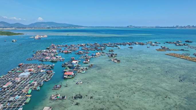 4k海南陵水疍家鱼排玻璃海海湾出海口航拍