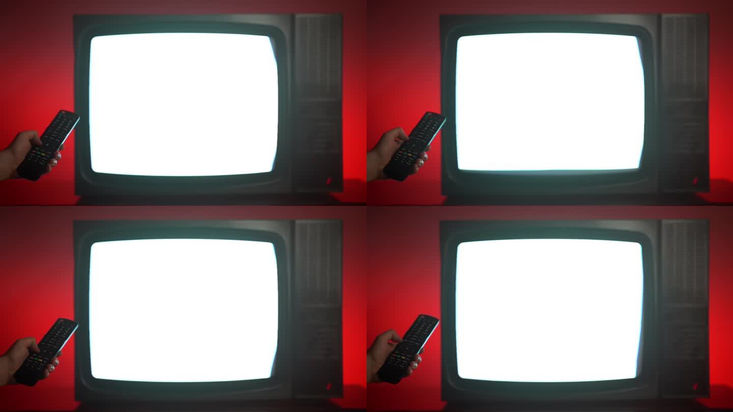 复古电视显示器电视信号差，屏幕闪烁有横条纹，干扰失真，人拿遥控器换台。红色背景的旧坏电视，古董电子概