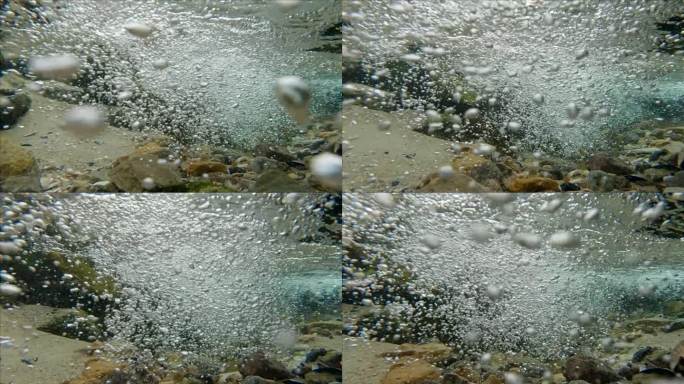 镜头向前移动到山间河流的流动，混合着流入大海的气泡