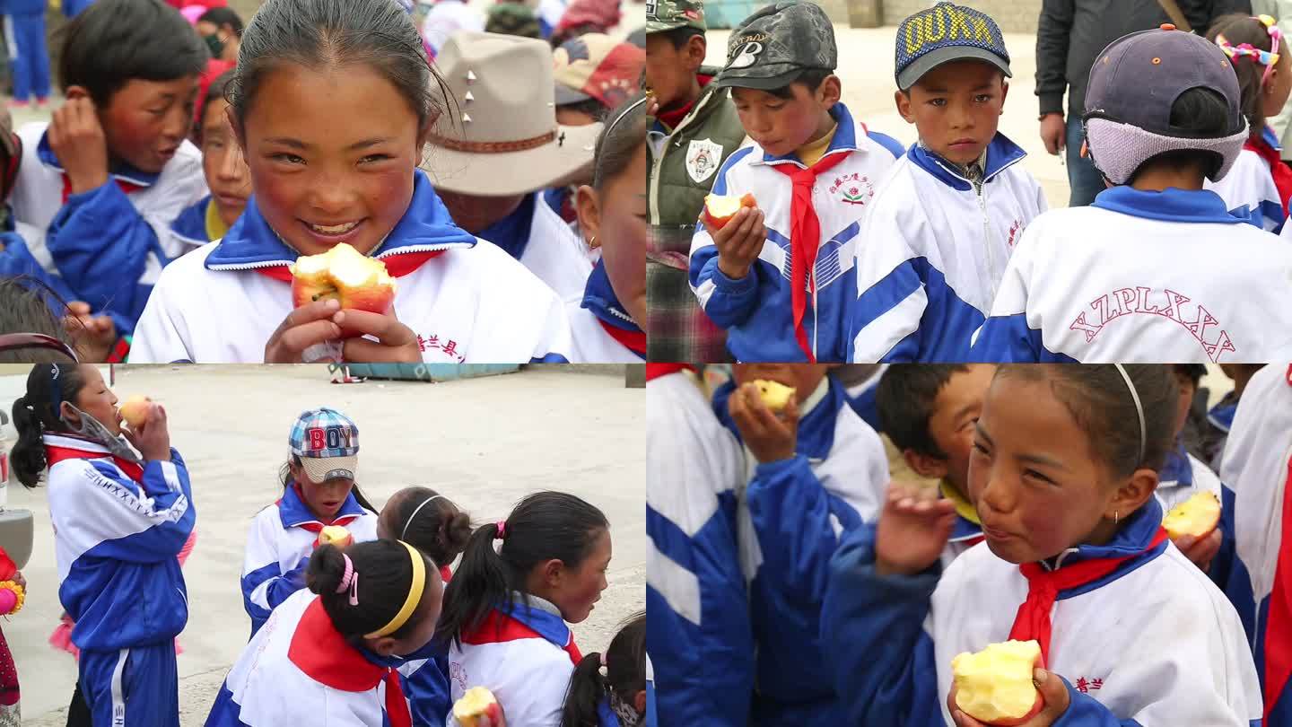 西藏普兰县小学吃苹果的孩子们