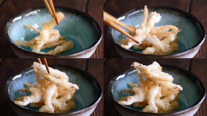 白虾是富山的特色菜。把天妇罗白虾放在盘子里的视频。
