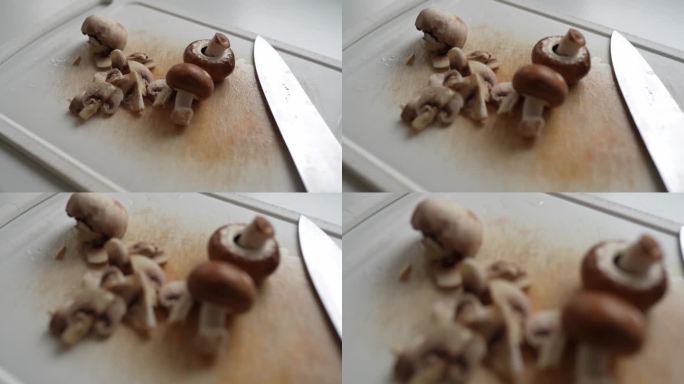 在砧板上切香菇切片