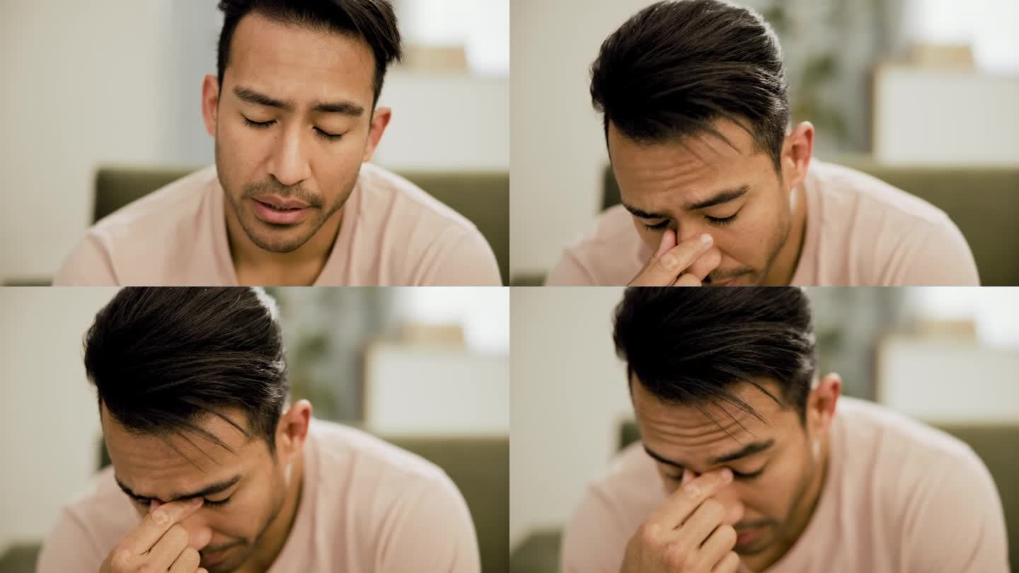 压力、抑郁和一个亚洲男人坐在沙发上，在家里有心理健康危机、错误或内疚。焦虑，倦怠和面对日本男性在客厅