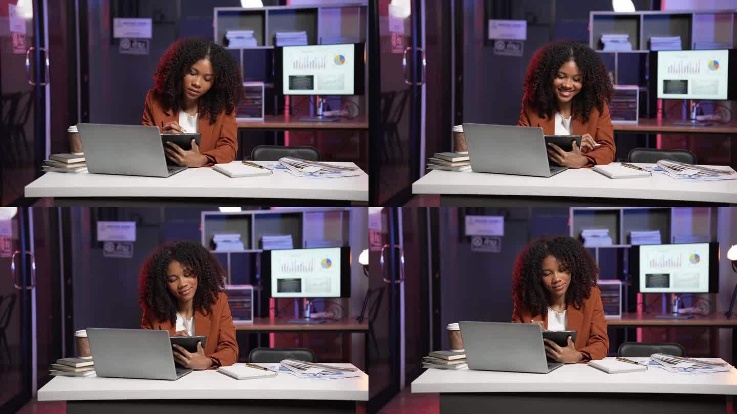 非洲女企业家查文件发邮件，职业商人上网冲浪，以彩灯为背景，按期加班的概念