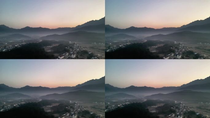 清晨的山下村落云雾缭绕
