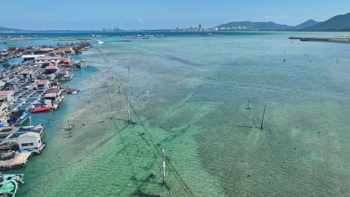 4k海南陵水疍家鱼排玻璃海海湾出海口航拍