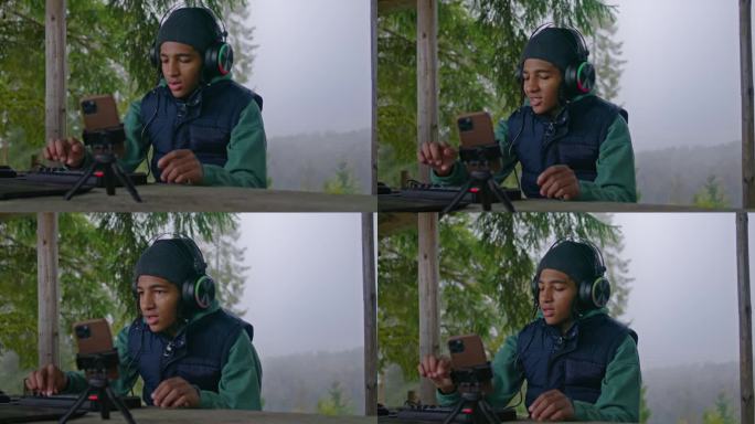 非裔美国少年在户外使用音乐迷笛键盘
