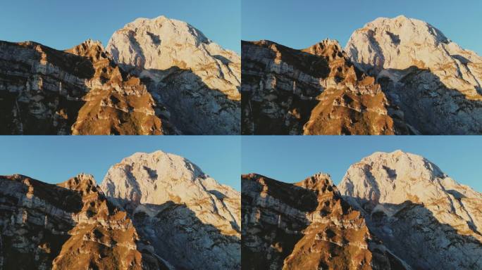 低角度无人机拍摄的雄伟的落基山脉对清澈的蓝天在白天