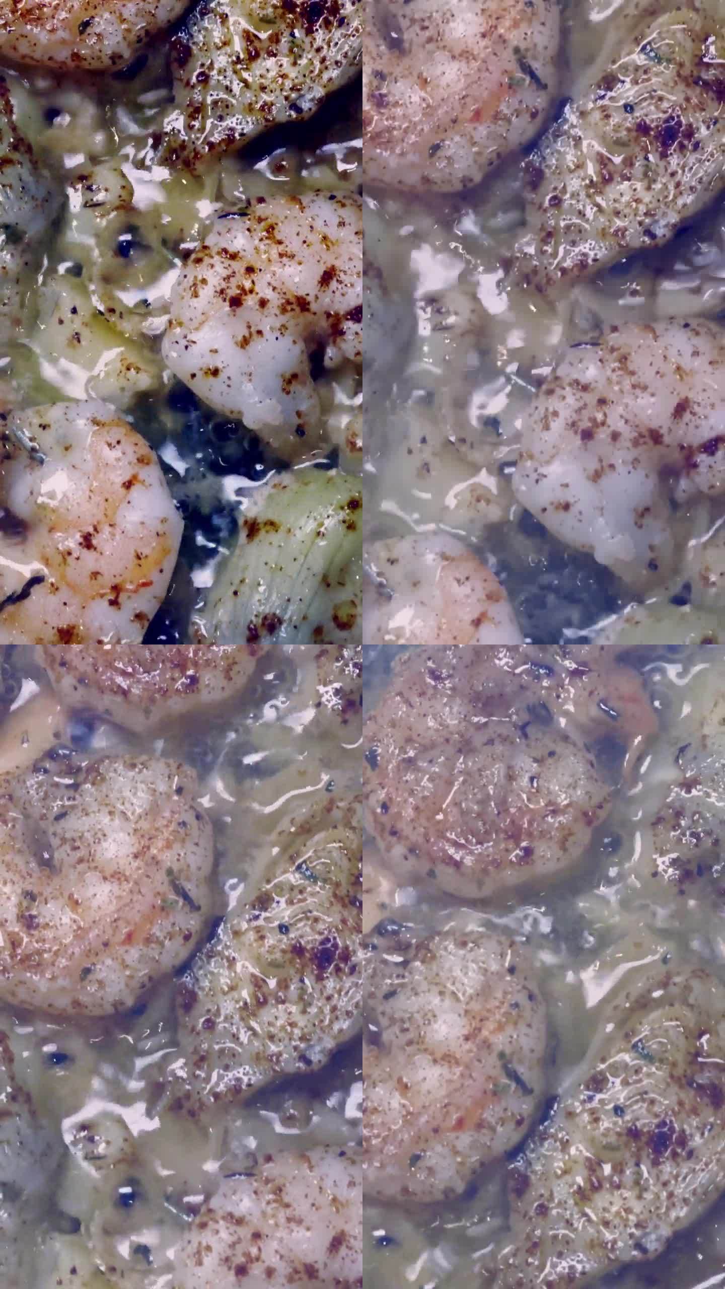 垂直视频虾虾与大蒜、蘑菇和洋蓟一起在平底锅里蒸