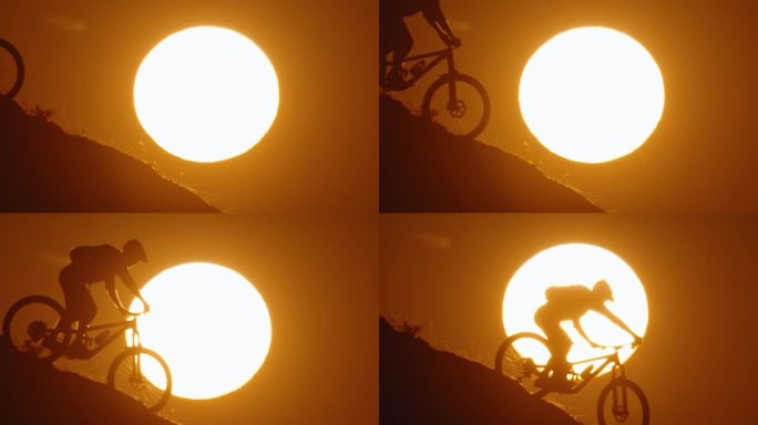 SLO MO剪影山地自行车自行车下坡对雄伟的太阳在晴朗的天空在日落