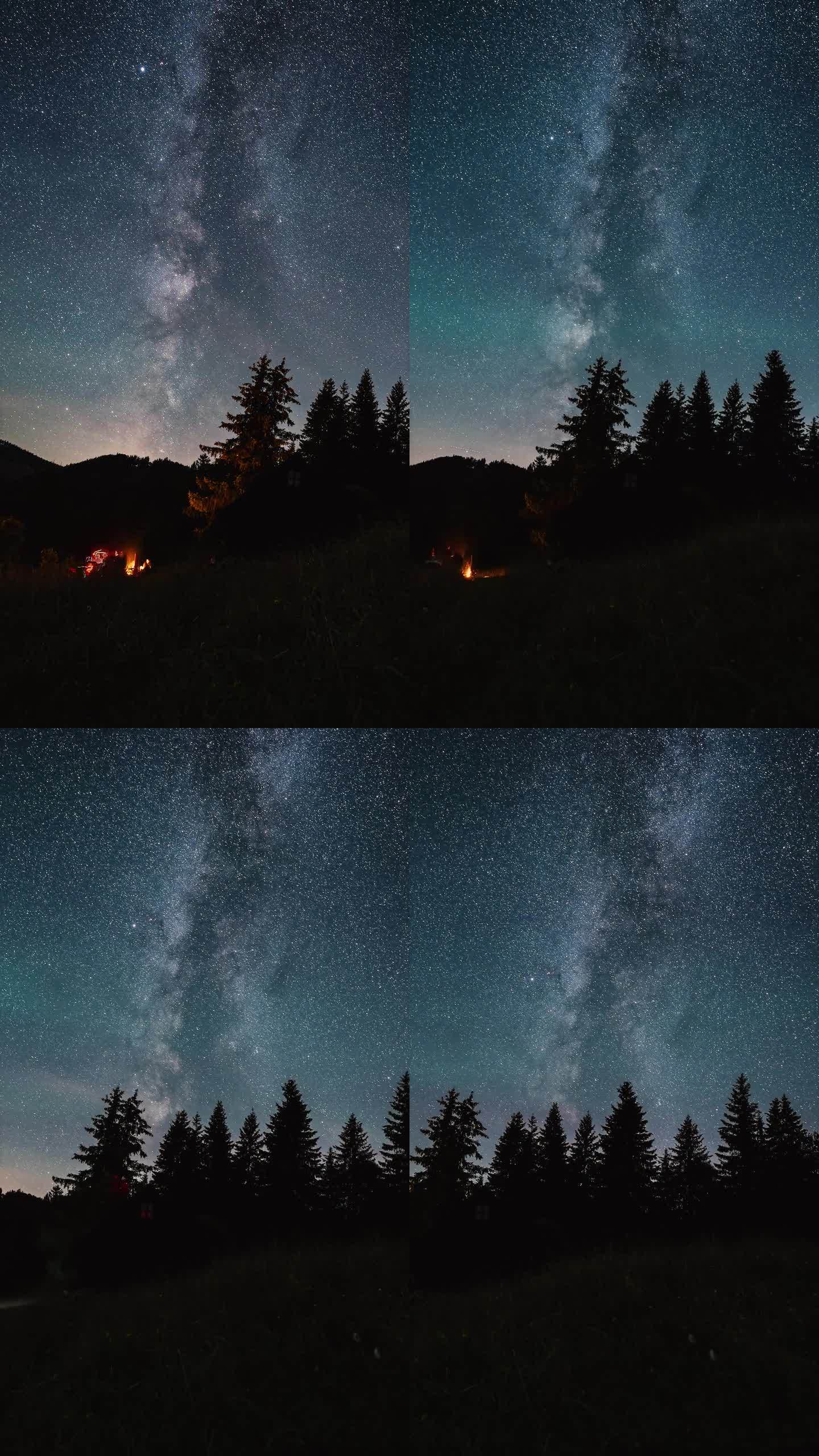 朋友们坐在星空下篝火旁的垂直视频，银河系的星星在森林的自然中