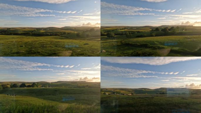 在金色的夕阳下，乘坐风景优美的火车穿过苏格兰乡村连绵起伏的山丘