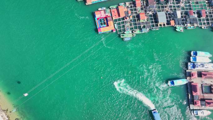 4k海南陵水疍家鱼排玻璃海海湾出海口航拍