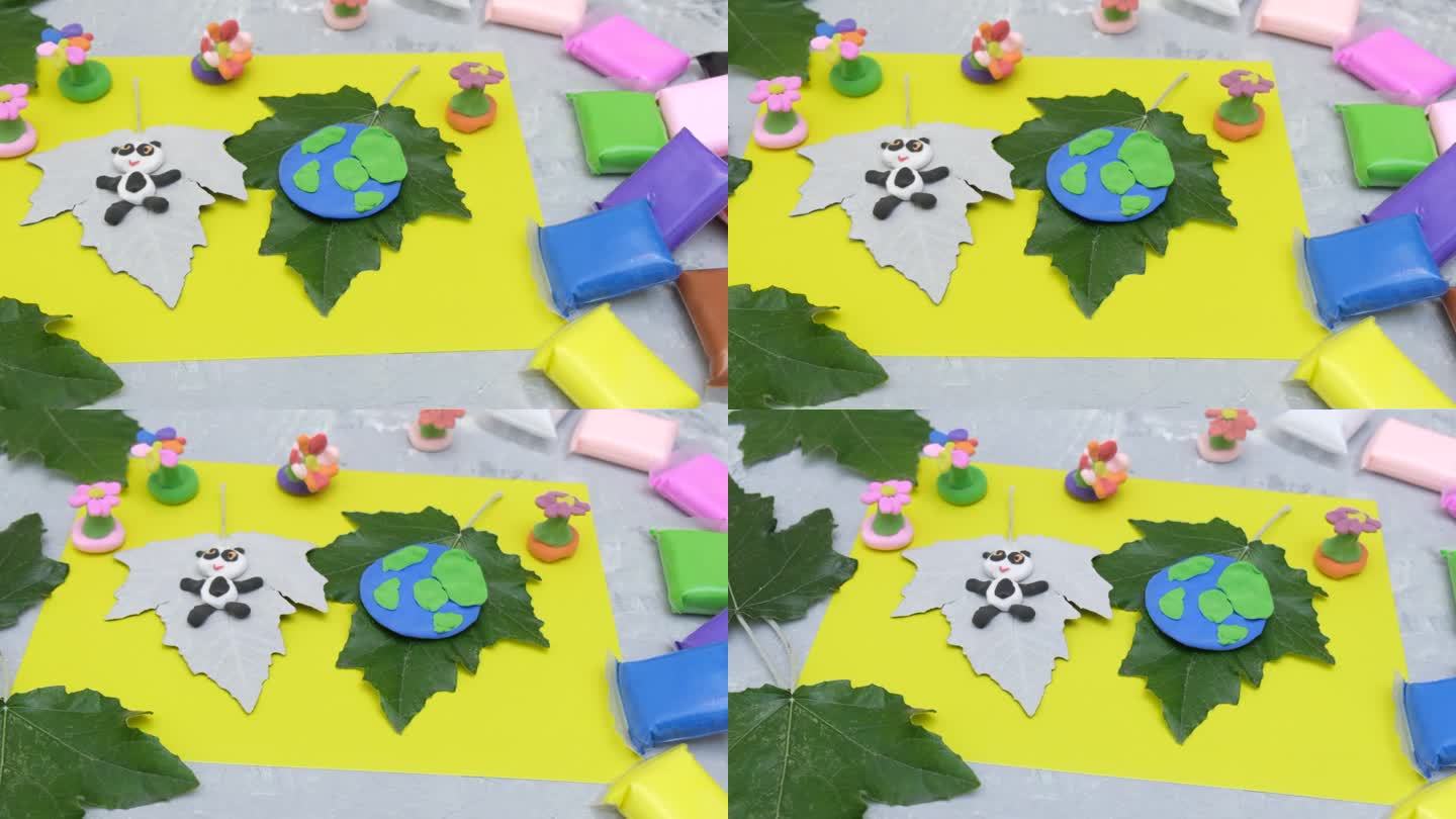 孩子们为地球日制作橡皮泥星球。保护环境，拯救地球。生态学的概念。