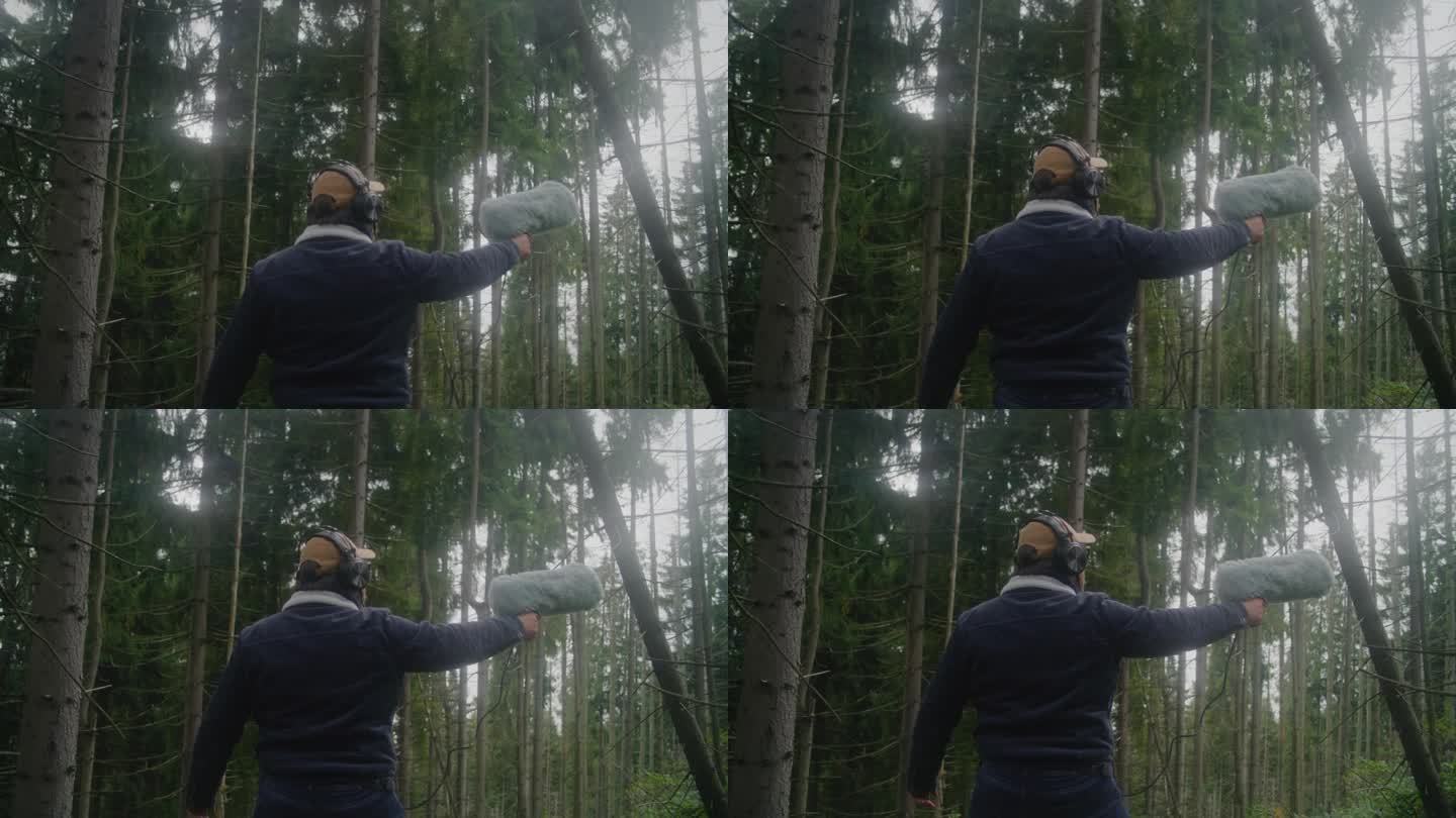戴着耳机的高加索人在森林里录下了大自然的声音